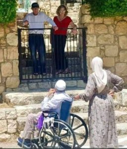 An old Palestinian couple in front of their stolen house now inhabited by jewish settlers from Brooklyn Ny-USA